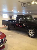 Finished classic Ford pickup in gloss black with Allegheny County Customs door lettering