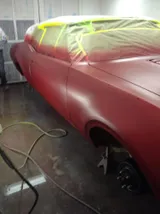 Oldsmobile body masked and primed in the paint area