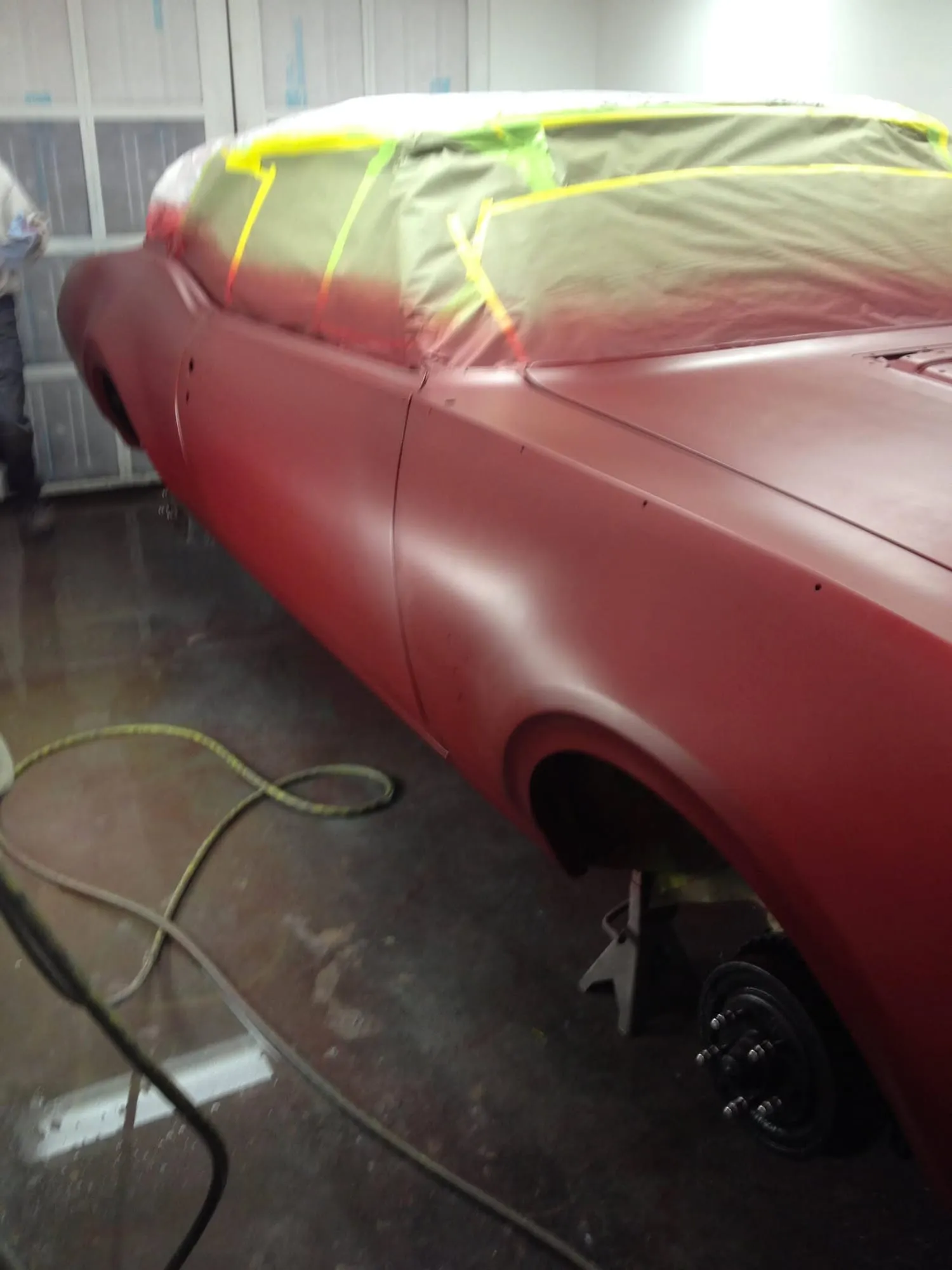 Oldsmobile body masked and primed in the paint area