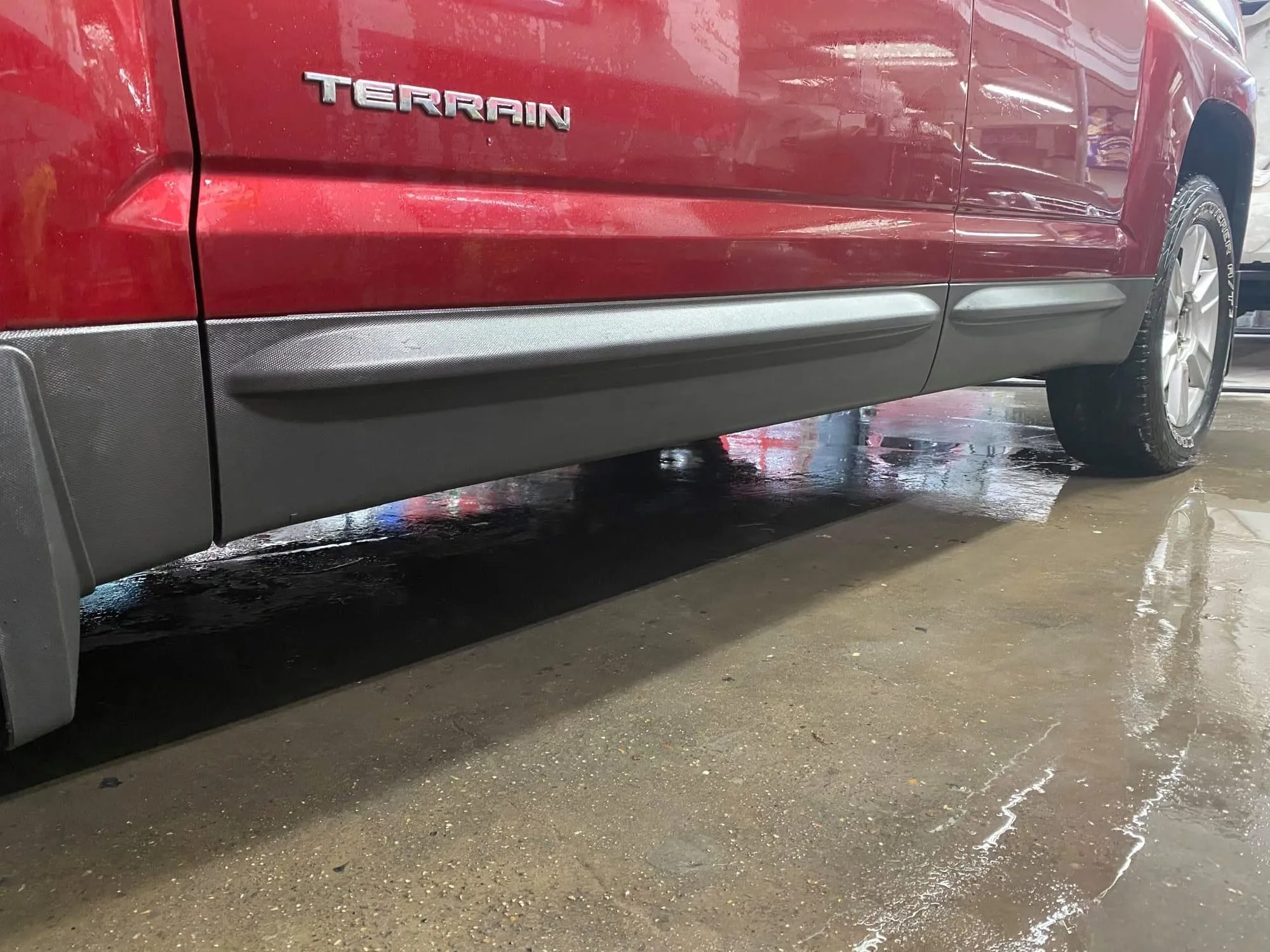 Finished rocker and lower body on the red GMC Terrain