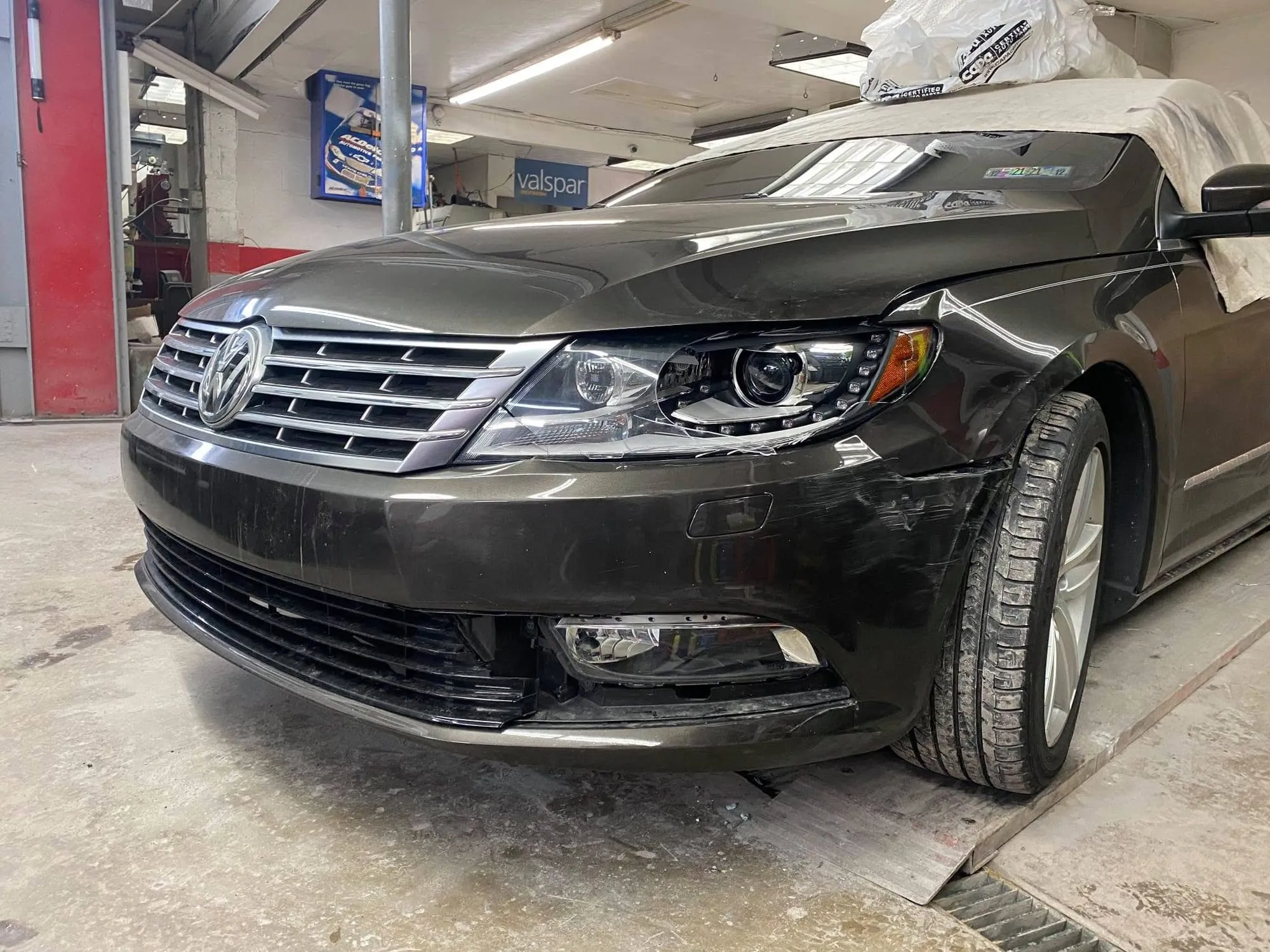 Volkswagen CC with front corner damage in the shop